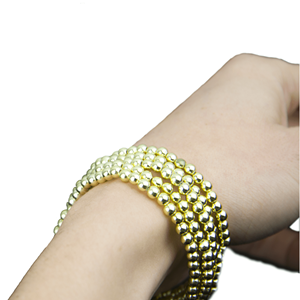 Pulseira de Miçangas Douradas